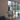 Modern interior with black steel double door and side panels separating living room and dining area