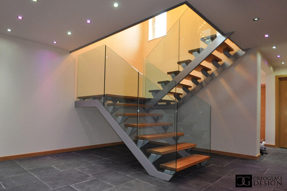 Open timber staircase with glass balustrades