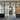 Industrial-style black framed double glass doors with side panels in a modern interior