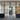 Industrial-style black framed double glass doors with side panels in a modern interior
