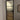 Modern interior door with frosted glass panels and black metal frame in minimalist room