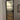 Modern interior door with frosted glass panels and black metal frame in minimalist room
