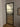 Modern interior door with frosted glass panels and black metal frame in minimalist room