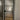 Black metal framed frosted glass interior door with home office seen through glass