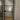 Black metal framed frosted glass interior door with home office seen through glass