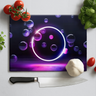 Neon purple bubbles design chopping board with kitchen knife, tomatoes, garlic, and basil on white surface
