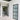 Modern interior with black framed glass hinged doors and white walls in a clean hallway