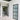 Modern interior with black framed glass hinged doors and white walls in a clean hallway