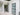 Modern interior with black framed glass hinged doors and white walls in a clean hallway