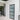 Interior with modern hinged black metal framed frosted glass door and adjacent clear glass double doors