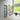 Modern interior hallway with frosted glass hinged door, console table, abstract art, and large window