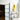 Modern frosted glass hinged door with black frame in bright room featuring abstract yellow painting and decorative table