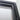 Close-up of a black hinged door frame with glass panel against white wall