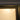 Close-up of a hinged door frame with frosted glass and matte black metal edging