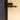Modern black metal hinged door handle on frosted glass panel door with blue frame