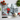 London-themed chopping board with red umbrellas art, fresh tomatoes, basil, garlic, and chef knife on white surface
