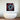 Bespoke decorative glass artwork with red and blue abstract design above modern bathtub
