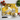 Floral decorative cutting board with tomatoes, basil, garlic, and chef knife on white surface