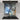 Abstract blue and grey marbled glass splashback in modern kitchen with induction hob