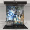 Abstract blue and grey marbled glass splashback in modern kitchen with induction hob
