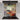 Abstract art glass splashback in modern kitchen with induction hob and stainless steel pot