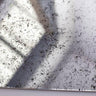 Antique-style speckled mirror with distressed finish, ideal for luxury residential or commercial decor