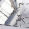 Bespoke decorative glass mirror with intricate etched patterns, ideal for luxury interiors and architectural features.