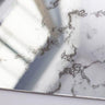 Bespoke decorative glass mirror with intricate etched patterns, ideal for luxury interiors and architectural features.