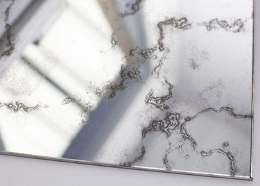 Bespoke decorative glass mirror with intricate etched patterns, ideal for luxury interiors and architectural features.