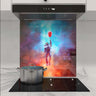 Custom glass splashback with astronaut and red balloon in cosmic nebula design for modern kitchen