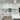 Bespoke blue abstract glass splashback in modern white kitchen with marble countertops