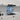 Bespoke blue and white abstract glass splashback in modern kitchen with marble countertop