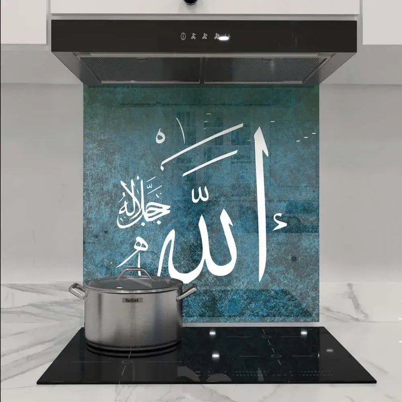 Bespoke decorative glass kitchen splashback with Arabic calligraphy on teal textured background