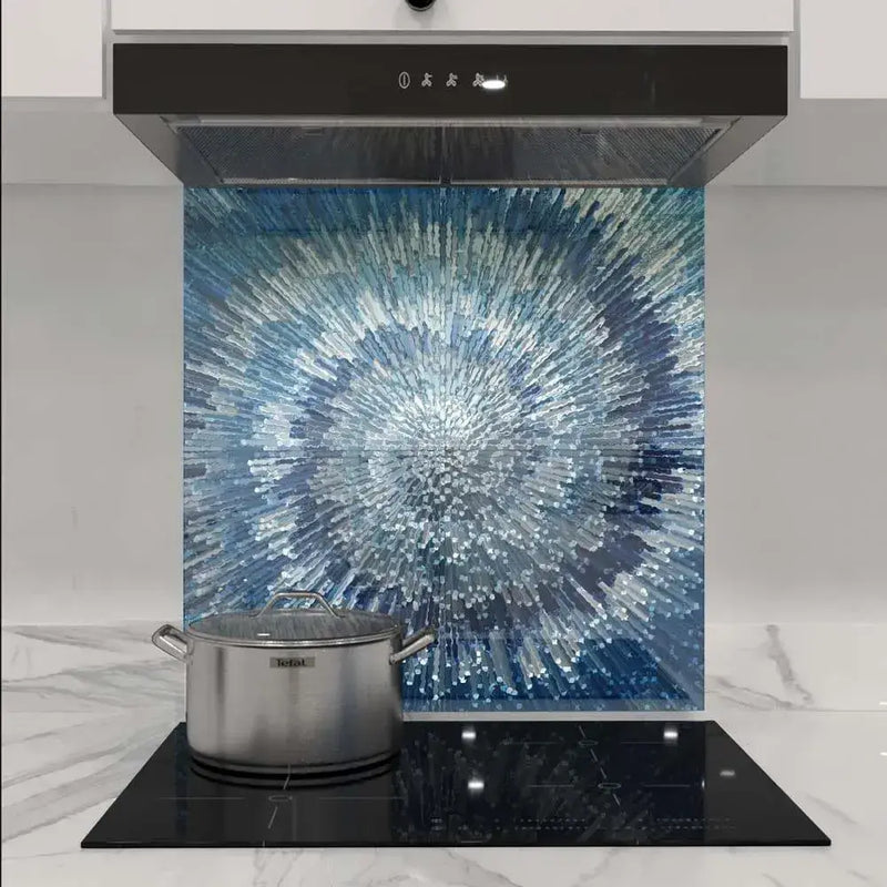 Bespoke blue abstract glass splashback in modern kitchen with induction hob and stainless steel pot