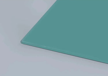 Teal-tinted architectural glass panel with polished edge, ideal for bespoke residential or commercial projects.