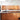 Copper sparkle glass backsplash and island front in modern luxury kitchen, bespoke decorative glass design