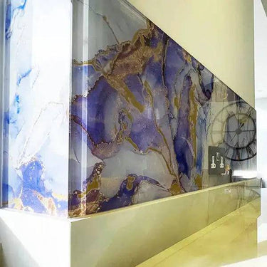 Bespoke decorative glass wall with blue and gold marble effect, ideal for luxury residential interiors