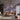 Bespoke LED backlit decorative glass wall art in modern living room with abstract purple and grey design