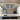 Bespoke kitchen mirror above marble countertop with modern pendant lights and built-in appliances