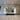 Bespoke feature mirror above kitchen island, reflecting luxury residential interior with recessed lighting