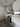 Modern kitchen with sleek white cabinets, glass backsplash, and built-in oven