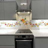 Bespoke decorative glass splashback with vibrant fruit design in modern kitchen, featuring LED backlighting