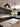 Modern kitchen with bespoke glass splashback, dark cabinets, and pendant lighting