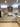 Modern kitchen with sleek white cabinets, marble backsplash, and LED under-cabinet lighting