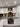 Colorful glass kitchen splashback with pasta design, modern white cabinets, stainless steel appliances