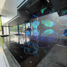 LED backlit glass kitchen splashback with vibrant leaf patterns, modern luxury interior design