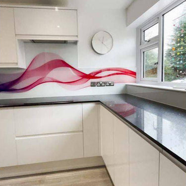 Modern kitchen with red wave-patterned decorative glass splashback and white cabinets