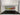 Custom glass splashback with wave design in yellow and red, installed in modern kitchen