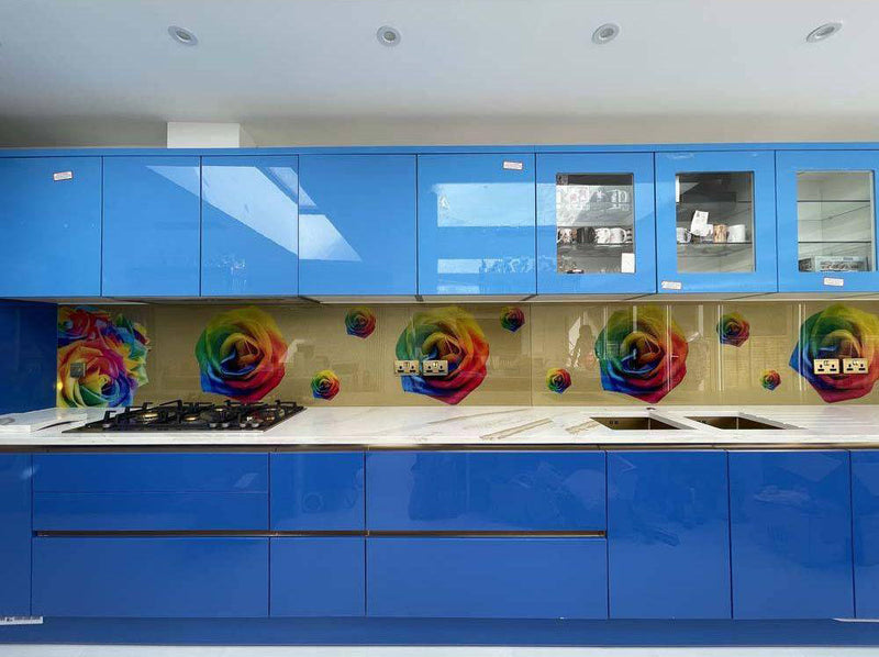 Vibrant rainbow rose printed glass splashback in modern blue kitchen, decorative glass feature
