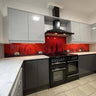 Red London skyline glass backsplash in modern kitchen with black range cooker and grey cabinets